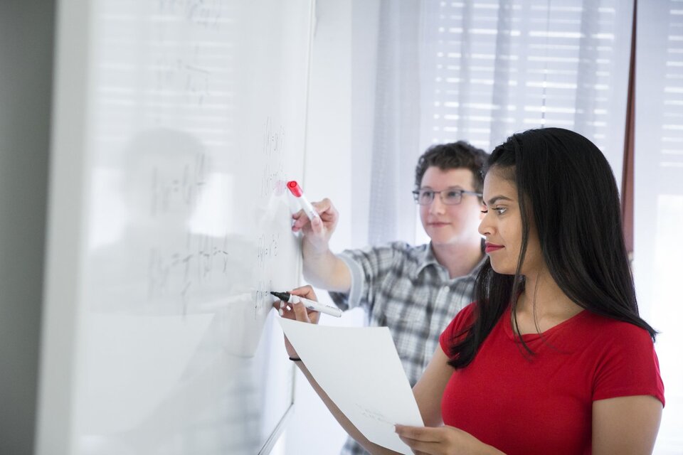 Bachelor business administration students-work-on-whiteboard.jpg