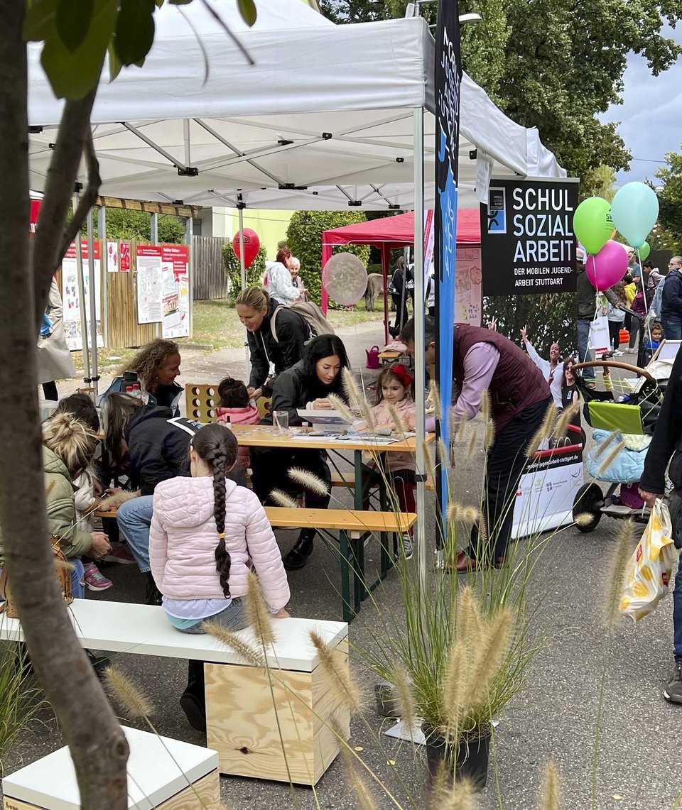  People sitting on benches at the stand