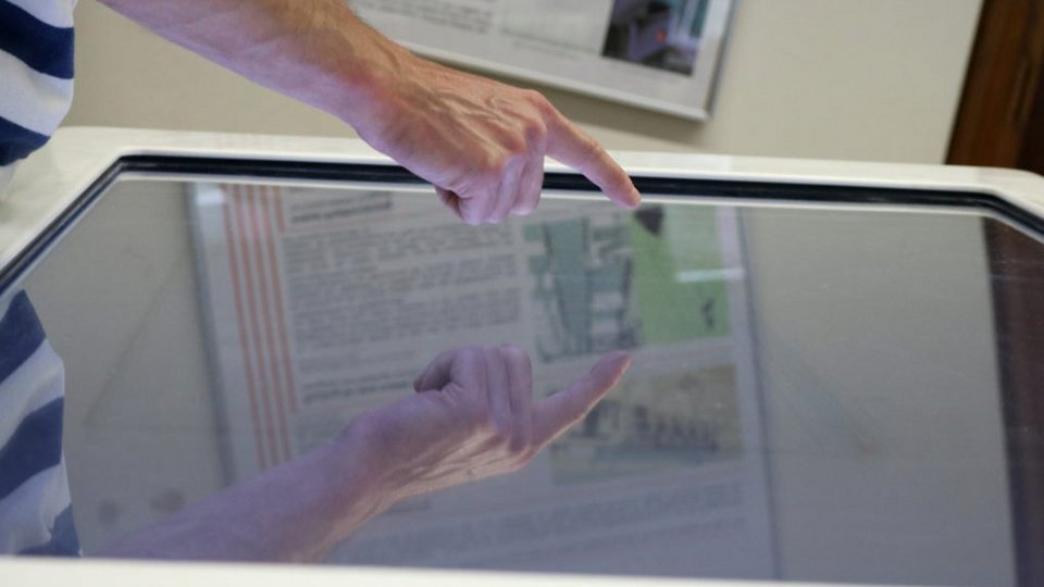 Person operates touch screen